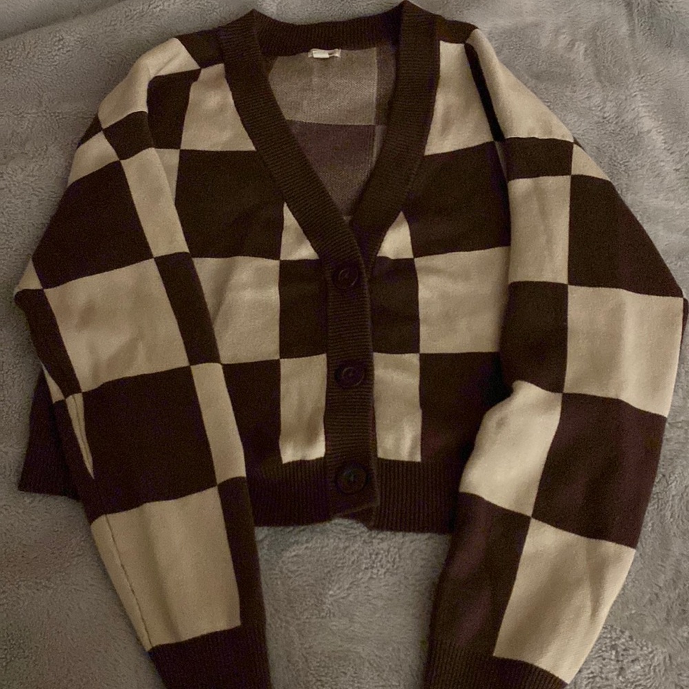 • brown & cream colored button up cardigan